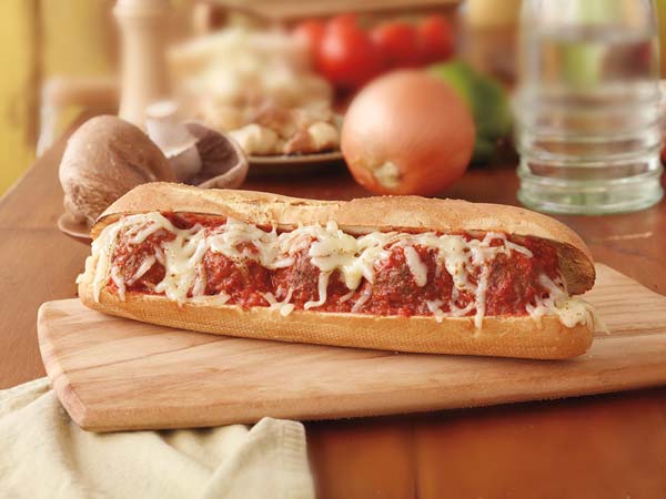 A masterfully crafted meatball sub with cheese
